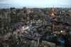 The Tokyo Tower, top right, stands illuminated in Tokyo, Japan, on Wednesday, Oct. 23, 2019. Japan has been attempting monetary-fiscal coordination since 2013, with a joint statement by the Bank of Japan and Prime Minister Shinzo Abe’s administration pledging to work toward 2% inflation and sustainable economic growth. Under Abenomics, as it’s known, the price goal was supposed to be achieved in just two years. Six years on, inflation is stuck below 1%.