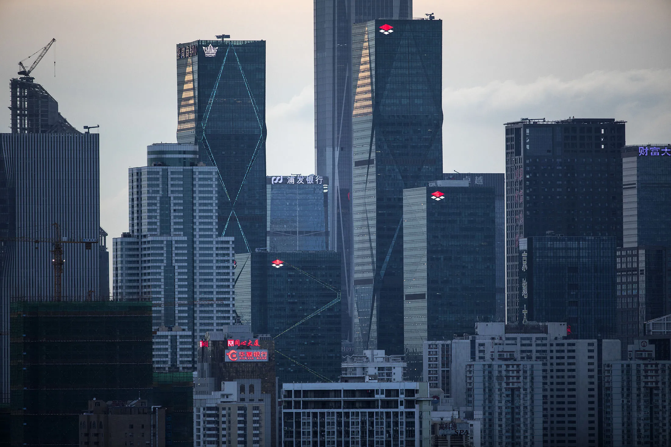 Buildings standing in Shenzhen are seen from the Ma Tso Lung district in Hong Kong, China, on Thursday, June 8, 2017. Shenzhen is pivoting from its legacy as ground zero for China's manufacturing boom into a center for research, development and production of advanced technology.
