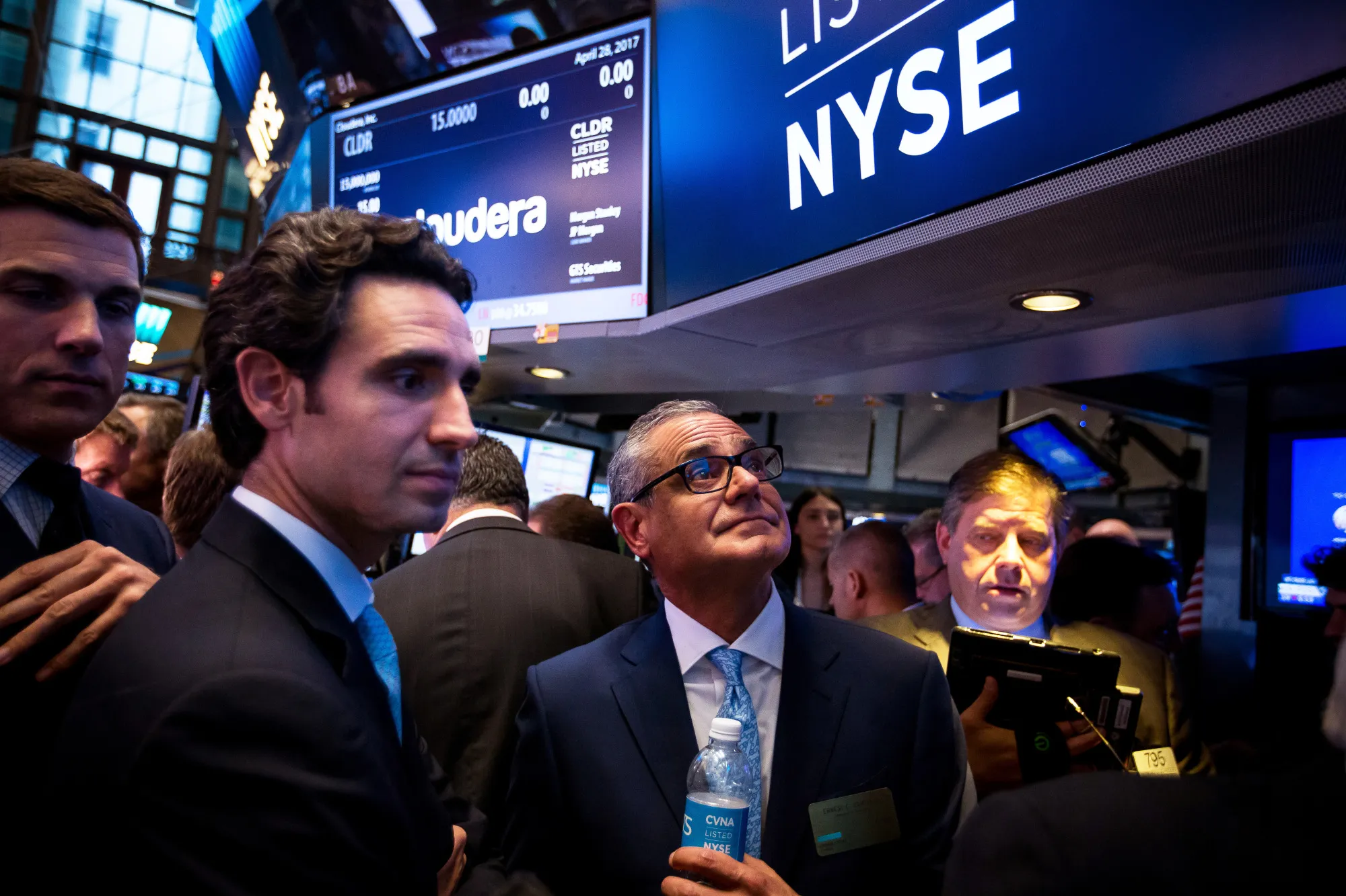 Ernie Garcia III, founder and CEO of Carvana, center left, and his father Ernest Garcia II, center right, during the company's IPO at&nbsp;the New York Stock Exchange in 2017.&nbsp;
