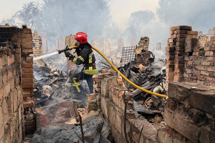 Emergency services at the site of a Russian attack in Ukraine in a photo released on July 9.