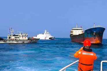 Taiwan Coast Guard personnel board a Togo-flagged a cargo ship off the coast of Penghu, Taiwan, on Feb. 25.
