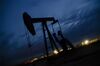 A pump jack stands at dusk in the Permian Basin area of Loving County, Texas, U.S., on Sunday, Dec. 16, 2018. Once the shining star of the oil business, gasoline has turned into such a drag on profits that U.S. refiners could be forced to slow production in response.