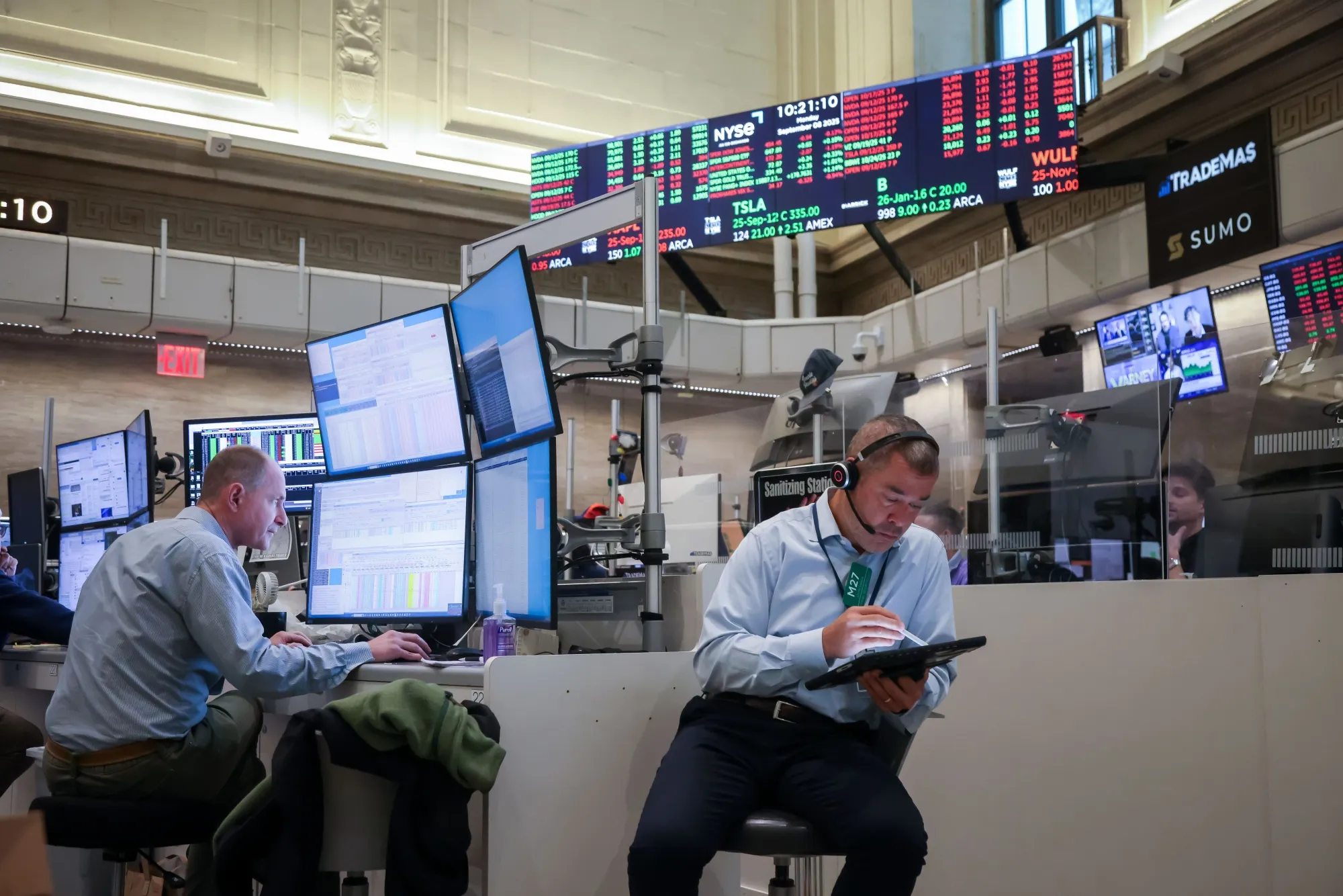 Traders work on the floor of the American Stock Exchange (AMEX) at the New York Stock Exchange (NYSE) in New York.
