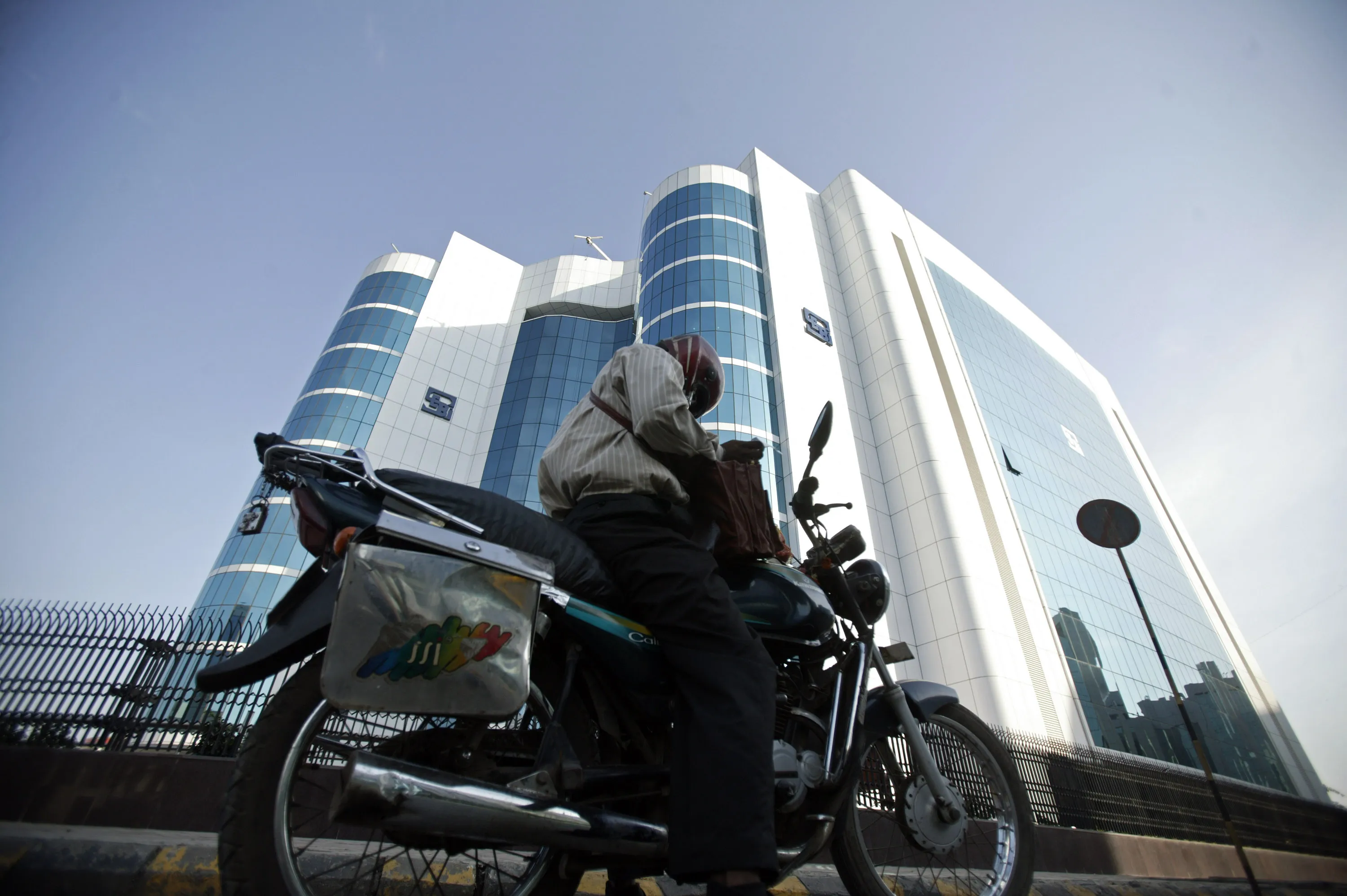 A man in front the Securities &amp; Exchange Board of India in Mumbai.