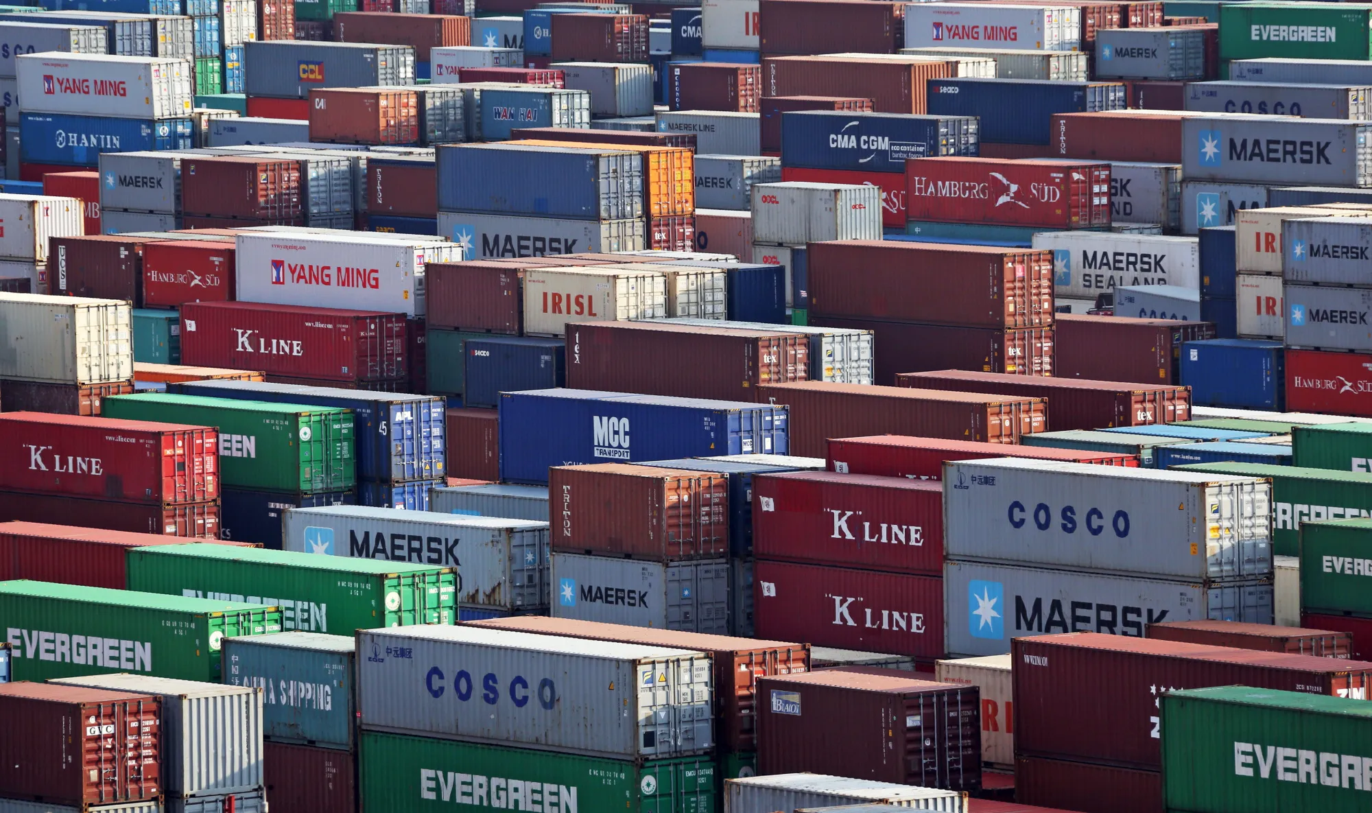 Shipping containers are stacked at the Yangshan Deep Water Port, part of China (Shanghai) Pilot Free Trade Zone's Yangshan free trade port area, in Shanghai, China, on Wednesday, Oct. 23, 2013. The area is a testing ground for free-market policies that Premier Li Keqiang has signaled he may later implement more broadly in the world's second-largest economy.
