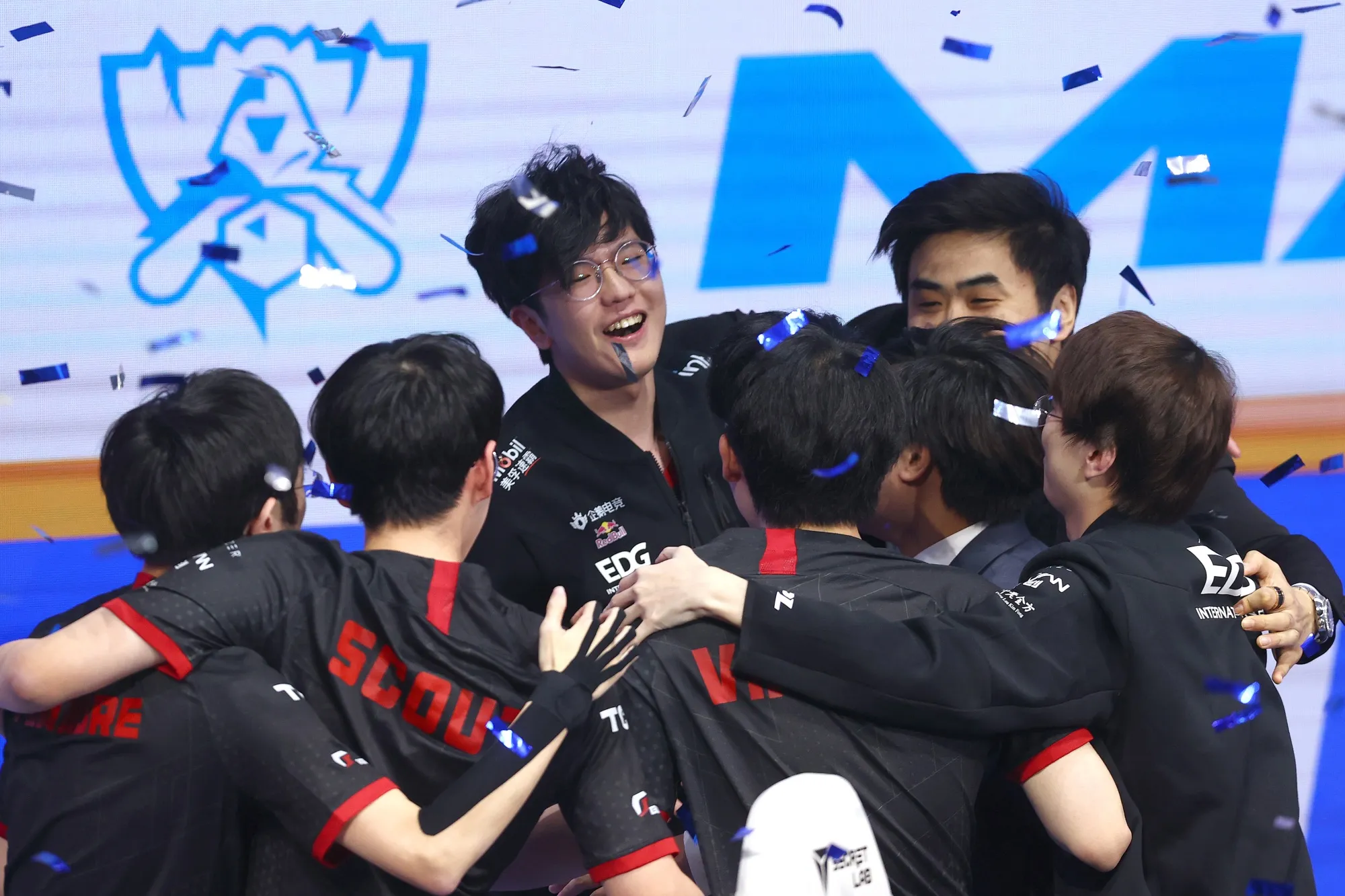 Members of EDward Gaming celebrate after winning the League of Legends World Championship Final.