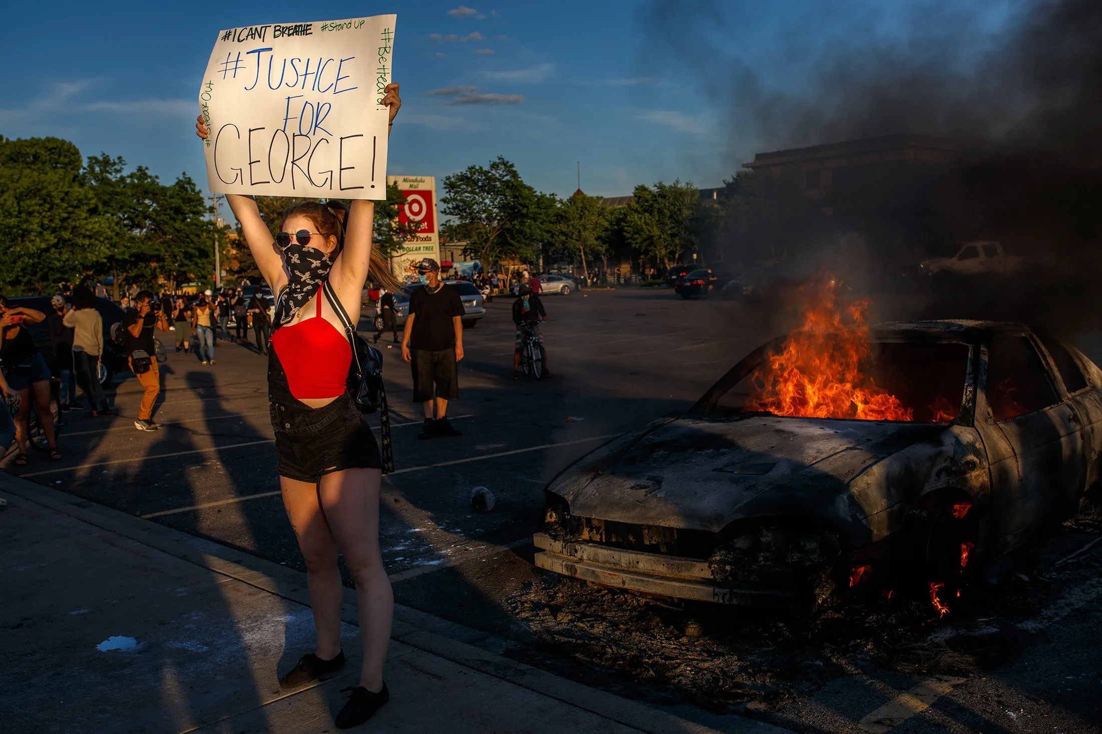 A protester hold sign reading "Justice for George" in Minneapolis on May 28.