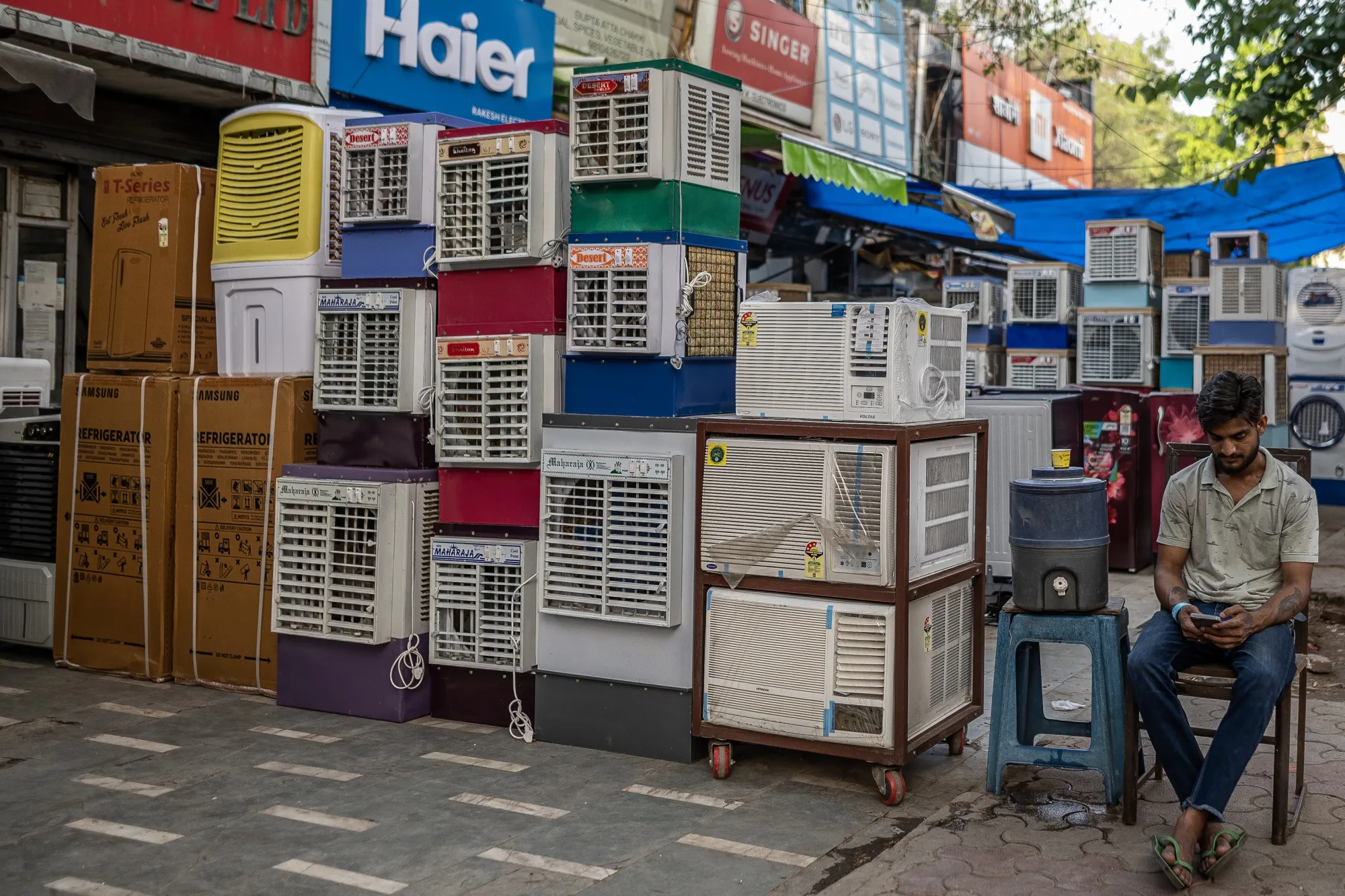 Air-conditioners and air-coolers displayed for sale at a store in New Delhi, India.