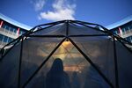 Visitors walk into a pollution pod during the UN Climate Change Conference COP25 in Madrid, on Dec. 2.