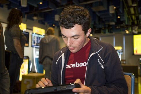 Facebook employee Gregory Rose uses a Wii U game console as he participates in a hackathon creating new levels for Super Mario Maker at the Facebook headquarters in Menlo Park, Calif., on July 29, 2015.