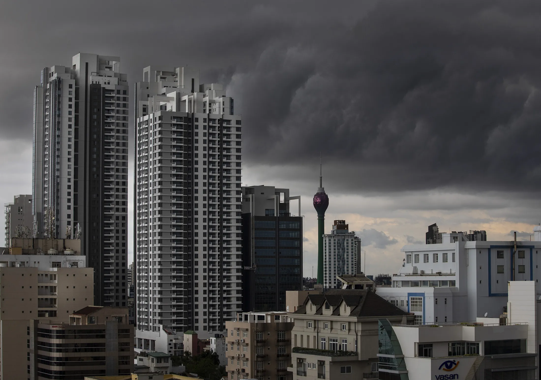 A storm&nbsp;on the horizon past the skyline of Colombo, Sri Lanka.