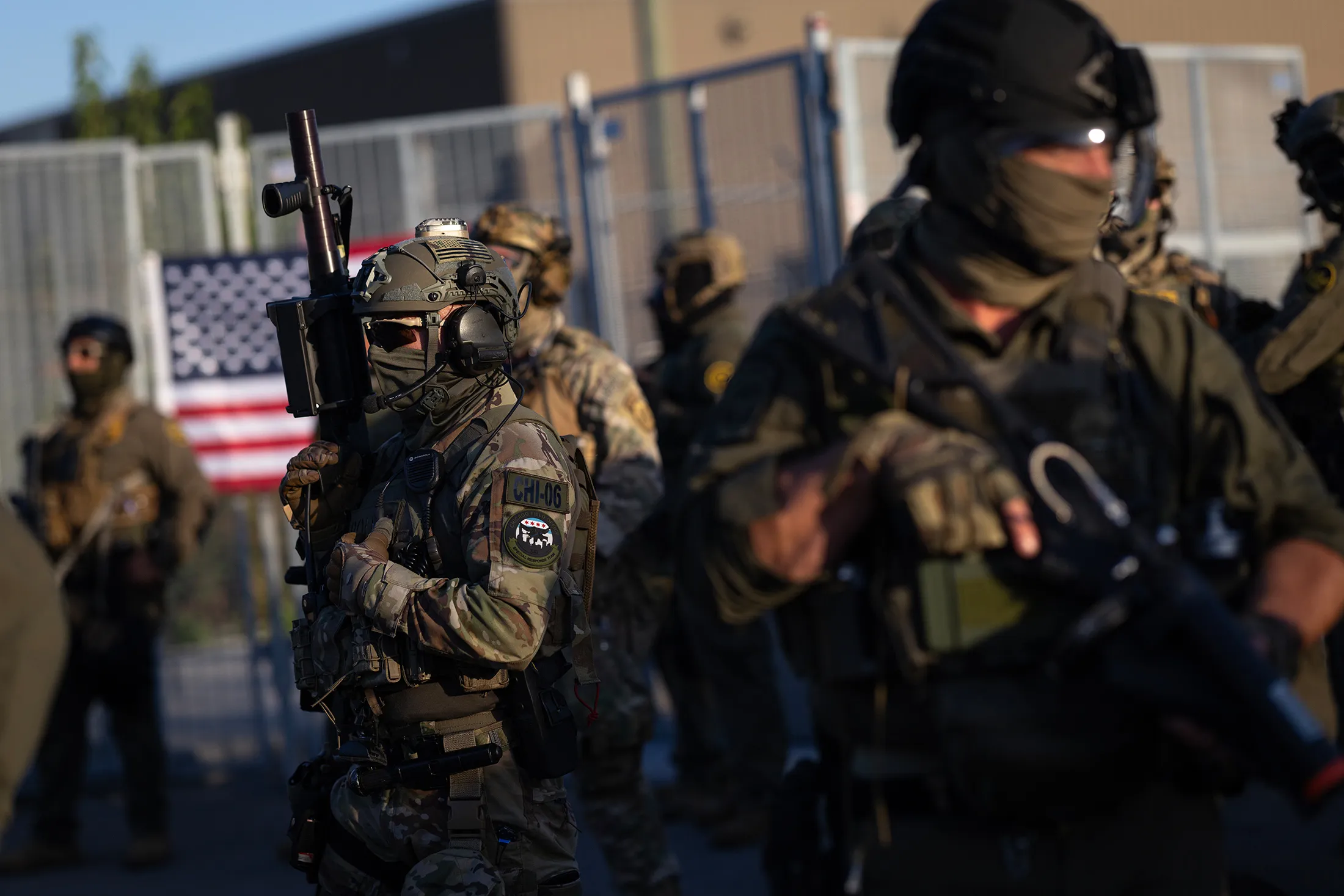 Federal law enforcement agents confront demonstrators protesting outside of an immigrant processing center in Broadview, Illinois, on Sept.&nbsp;27.