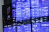 Screens display stock figures at the Tokyo Stock Exchange (TSE), operated by Japan Exchange Group Inc. (JPX), in Tokyo, Japan, on Monday, Oct. 22, 2018. Asian stocks and U.S. futures erased earlier losses Monday as Chinese shares built on a Friday rally after calls for calm from the country’s top finance officials.
