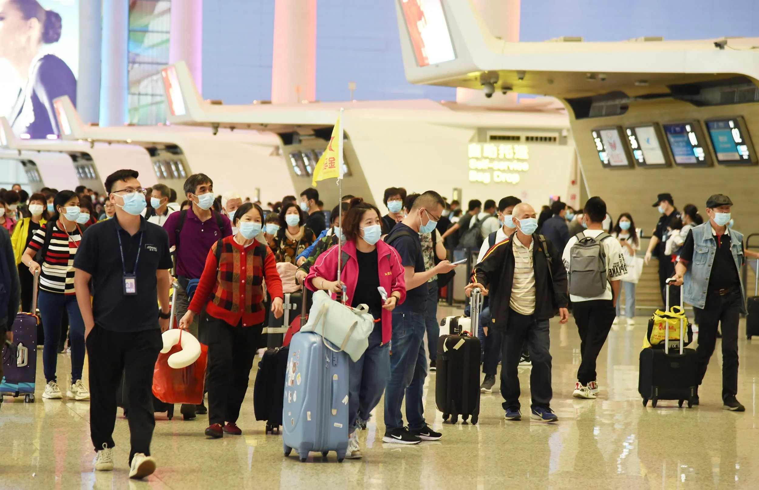 A tour group arrives at Baiyun International Airport in Guangzhou, on April 26.