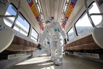 Workers disinfect a subway train in Gimpo, South Korea, Feb. 2020.