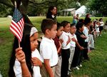 A class of Hispanic students recites the Pledge of Allegiance at Birdwell Elementary School on September 11, 2003, in Tyler, Texas.&nbsp;