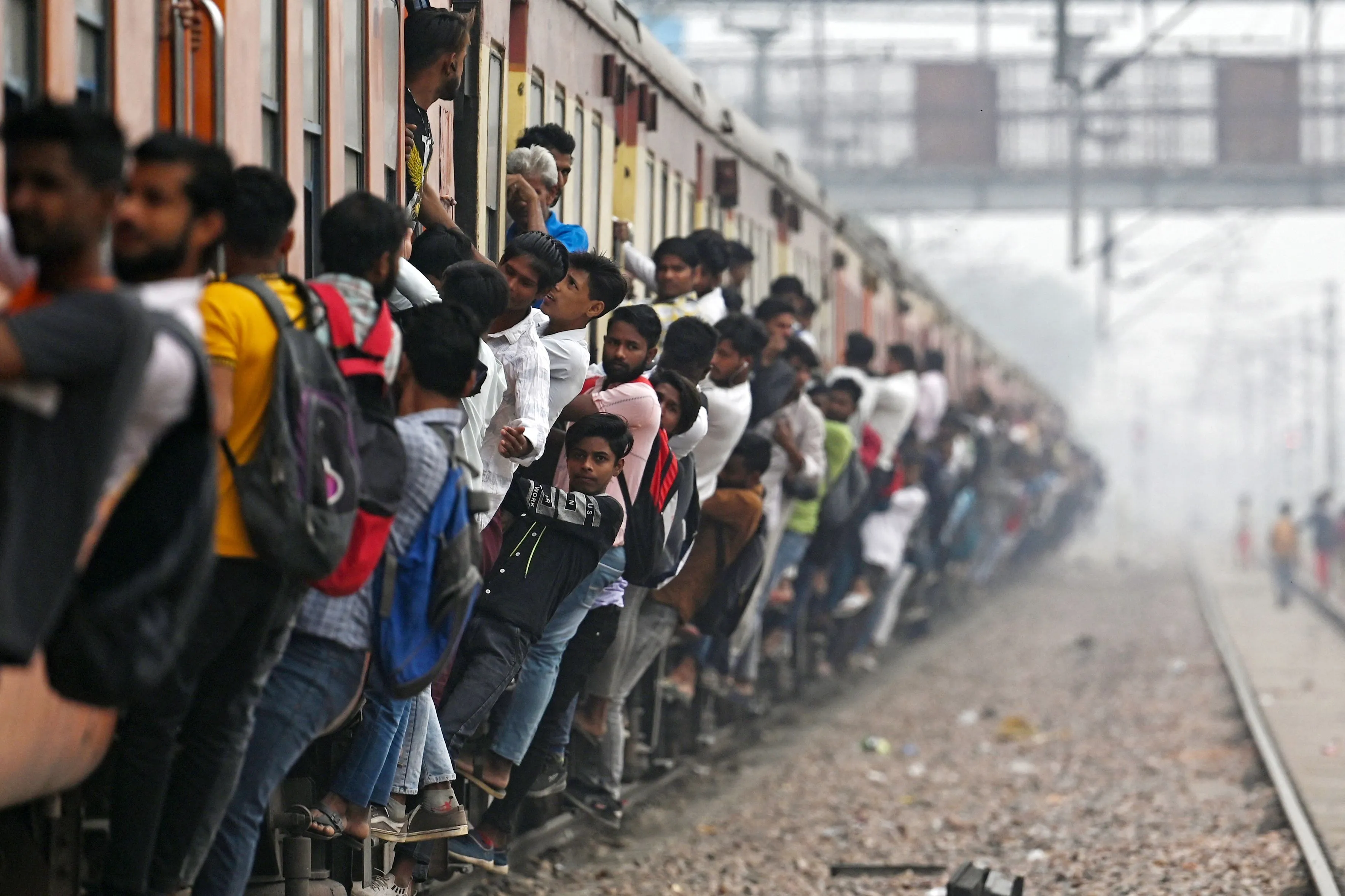 Commuters travel in an overcrowded train in India’s state of Uttar Pradesh.