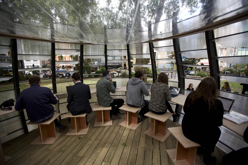 The inside of TREExOFFICE, a co-working space in London built around the base of a tree, in June 2015.