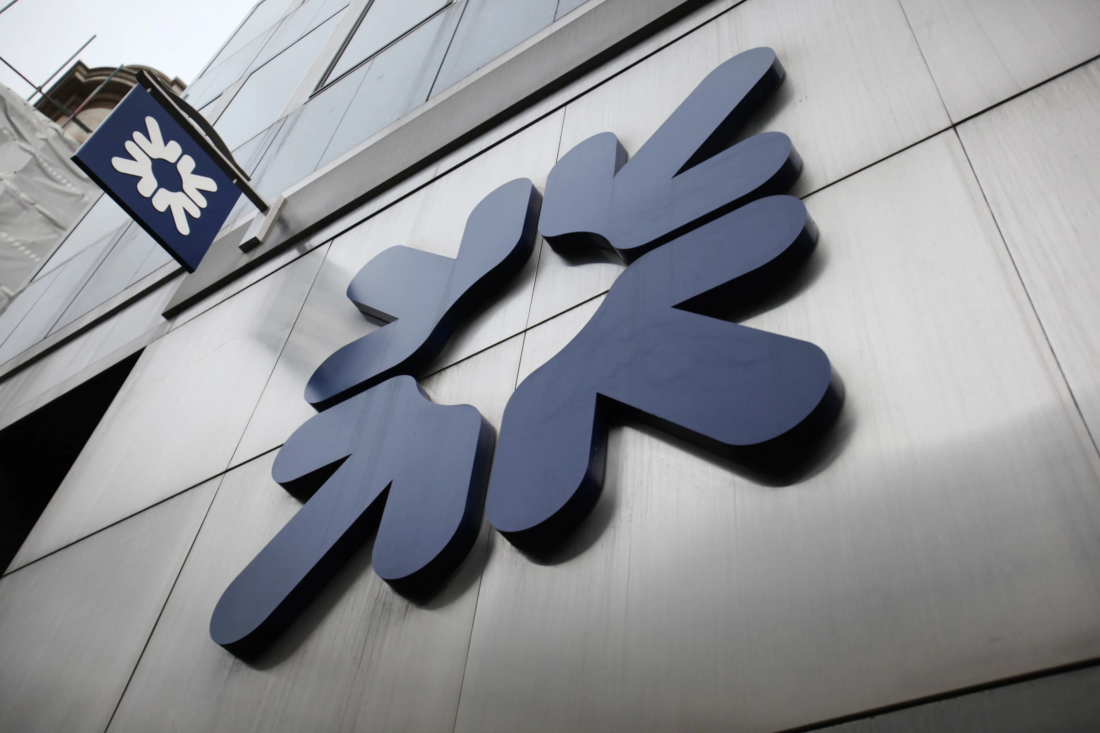 The RBS logo hangs outside the headquarters

