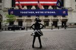 Fearless girl in front of New York Stock Exchange during the
