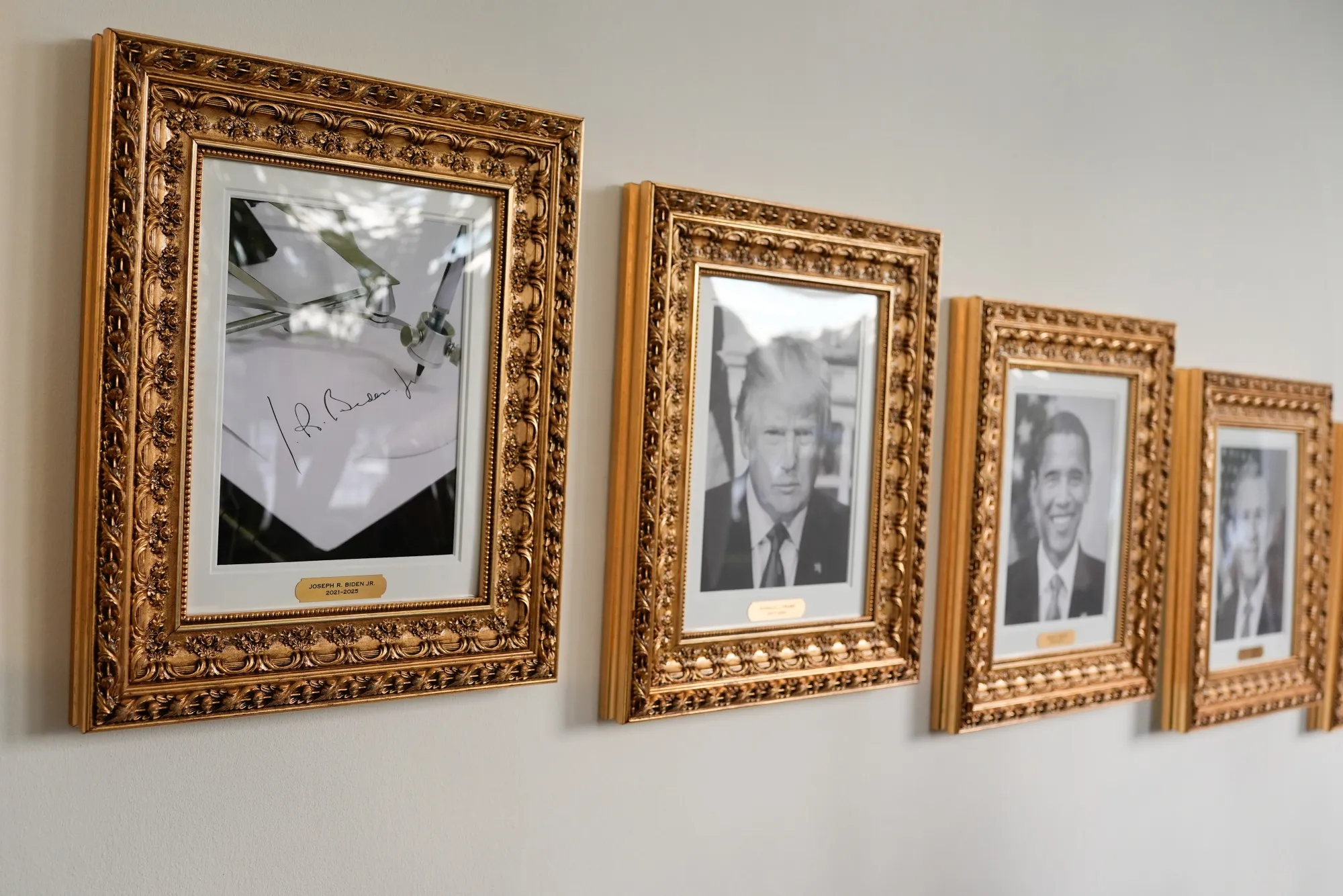 Images of an autopen signature of former US president Joe Biden, US President Donald Trump, former president Barack Obama, and former president George W. Bush displayed on the "Presidential Walk of Fame" along the Colonnade of the White House in Washington, DC.