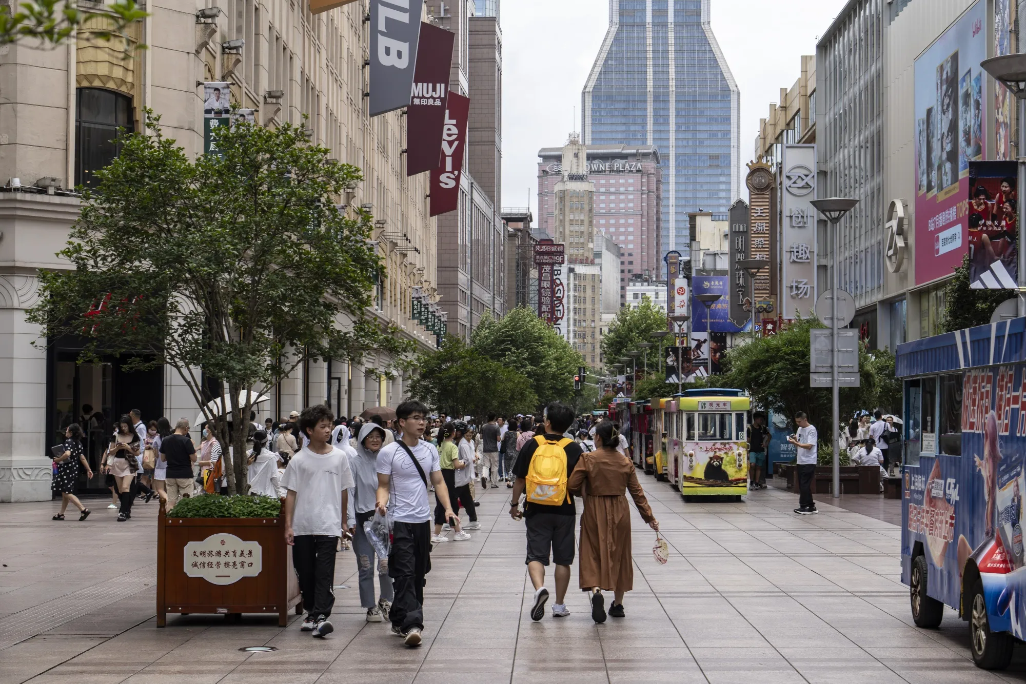 Pedestrians walk down Nanjing Road in Shanghai.