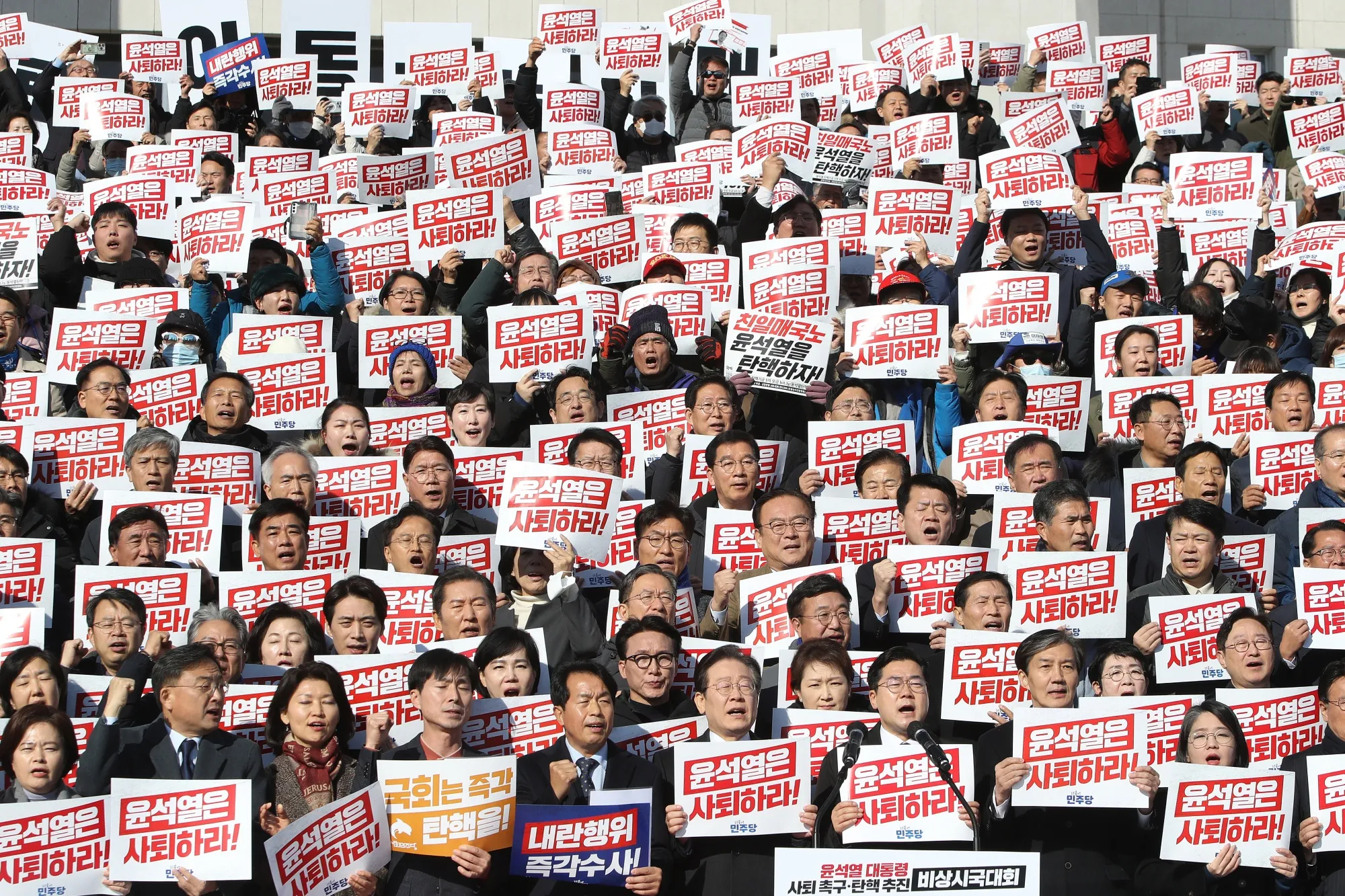 South Korea’s main opposition Democratic Party leader Lee Jae-myung and party members participate in a rally against the country’s president at the National Assembly on Dec. 4.