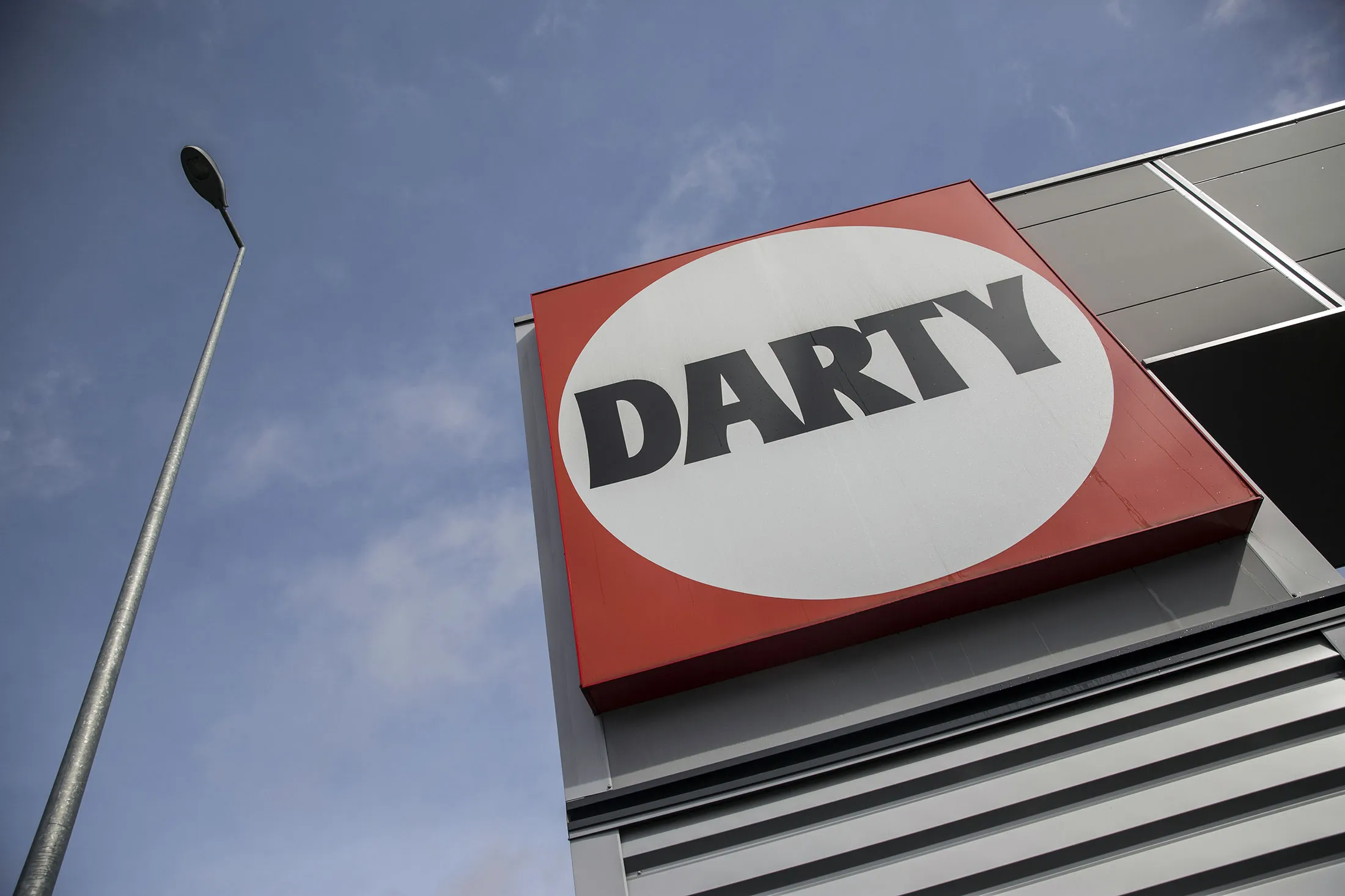 The Darty logo sits on a sign outside a Darty Plc electrical goods retail store in Sebazac, France, on Thursday, March 3, 2016. Steinhoff International Holdings NV Group made an unsolicited, 662-million-pound ($924 million) bid for French electronics retailer Darty, seeking to break up Groupe Fnac SA's agreement to buy the company.
