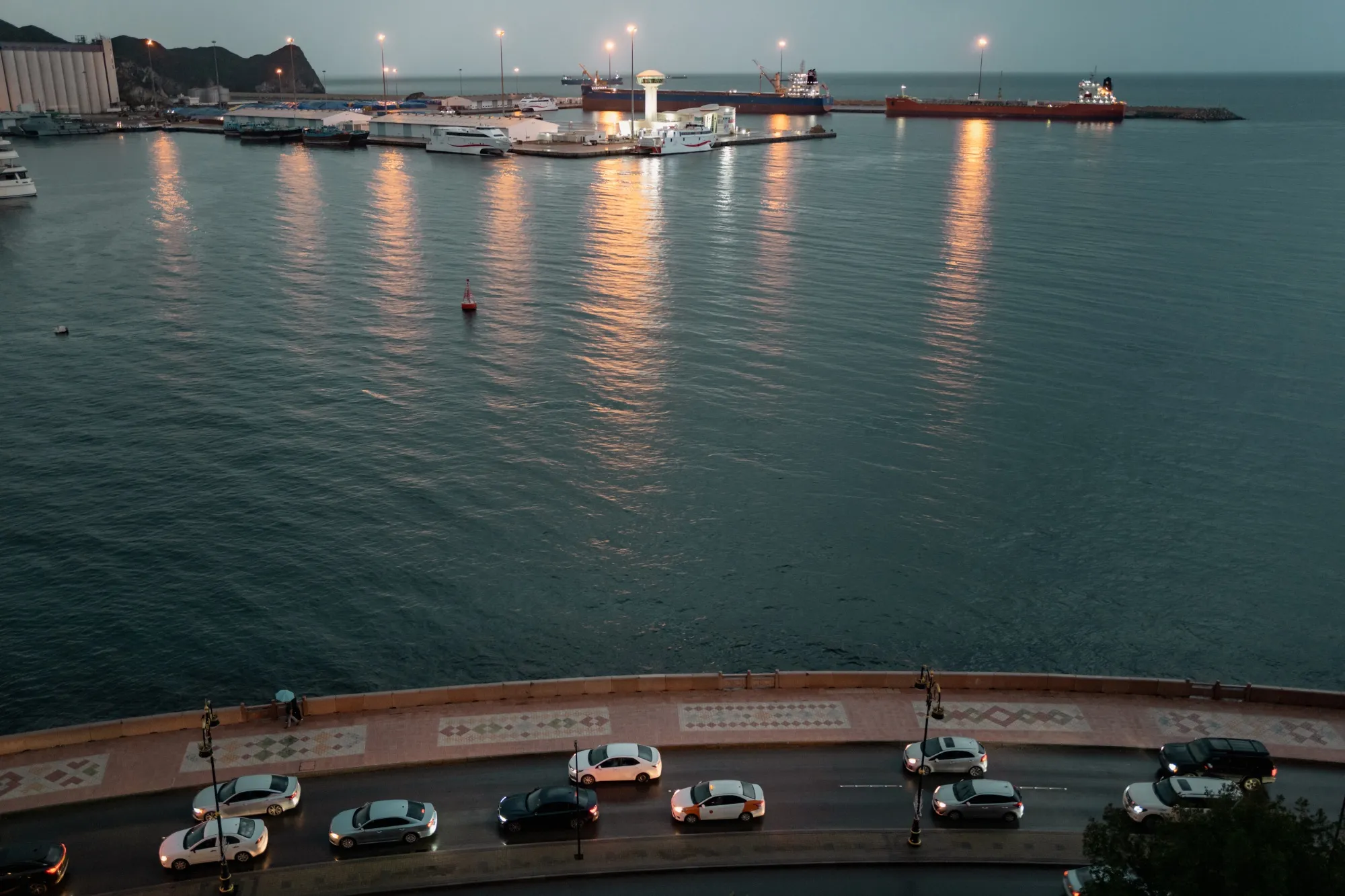 Two bulk carriers sit anchored at Muscat Anchorage on March 25, 2026.