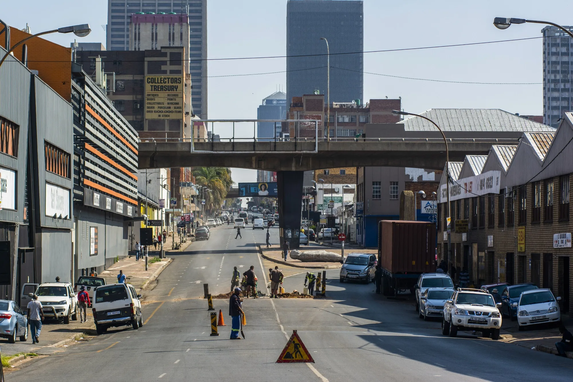 Municipal workers labour at a roadworks site in the Central Business District (CBD) of Johannesburg.