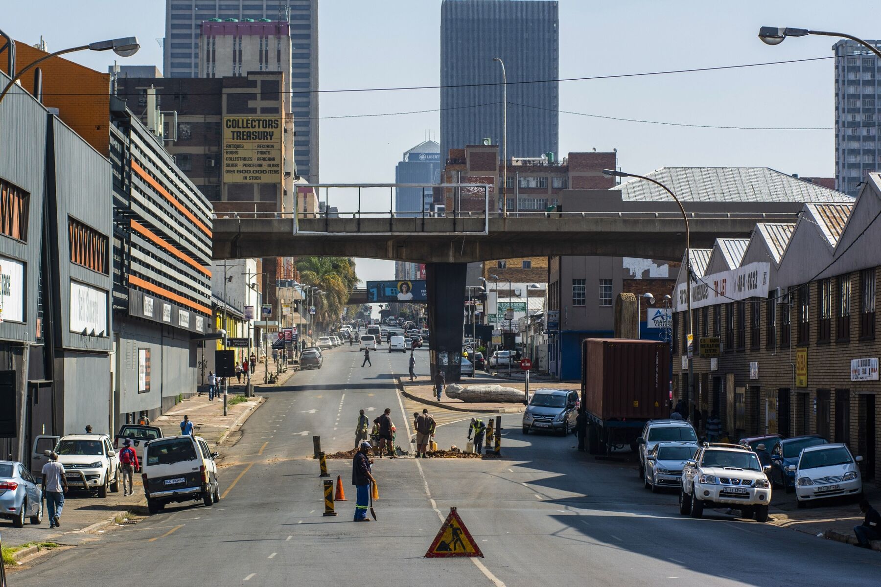 Municipal workers labour at a roadworks site in the Central Business District (CBD) of Johannesburg.