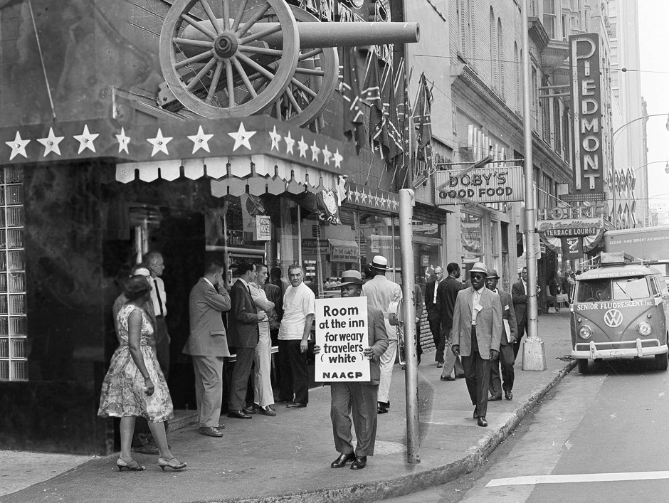 A protester outside an Atlanta restaurant that refused to serve African Americans in 1962.