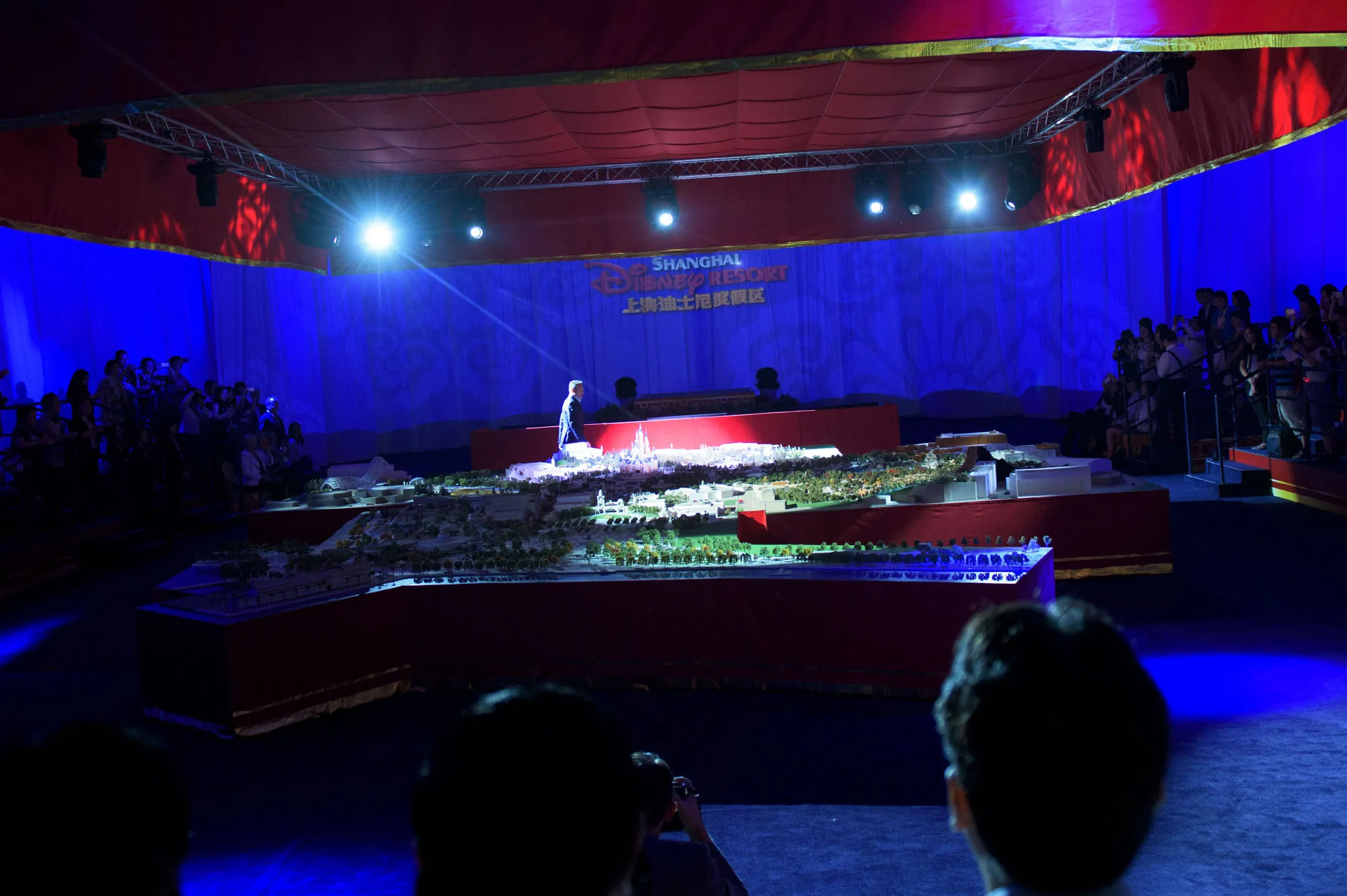 Walt Disney Chairman and CEO Bob Iger stands in front of an unveiled model of the new Shanghai Disney Resort during a press event in Shanghai on July 15, 2015.
