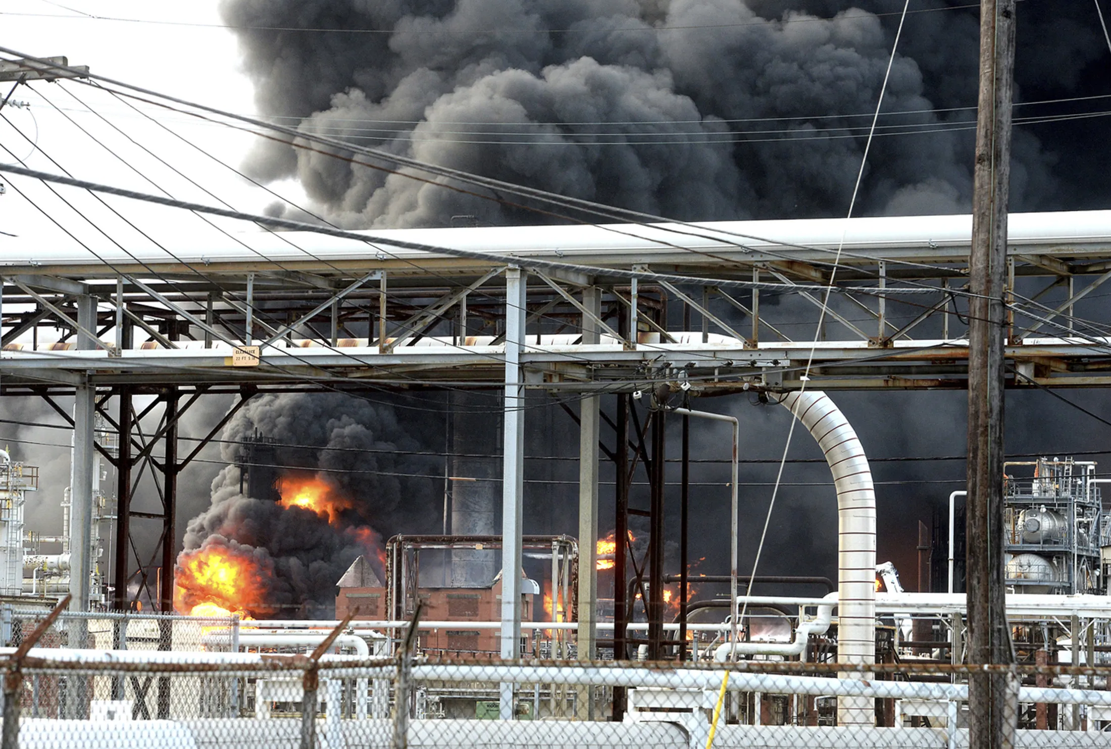 Thick smoke fills the sky above the TPC Group Port Neches Operations in Port Neches, Texas,&nbsp;on&nbsp;Nov. 27.