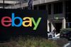 A pedestrian walks past eBay Inc. signage at the entrance to the company's headquarters in San Jose, California.