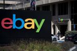 A pedestrian walks past eBay Inc. signage at the entrance to the company's headquarters in San Jose, California.