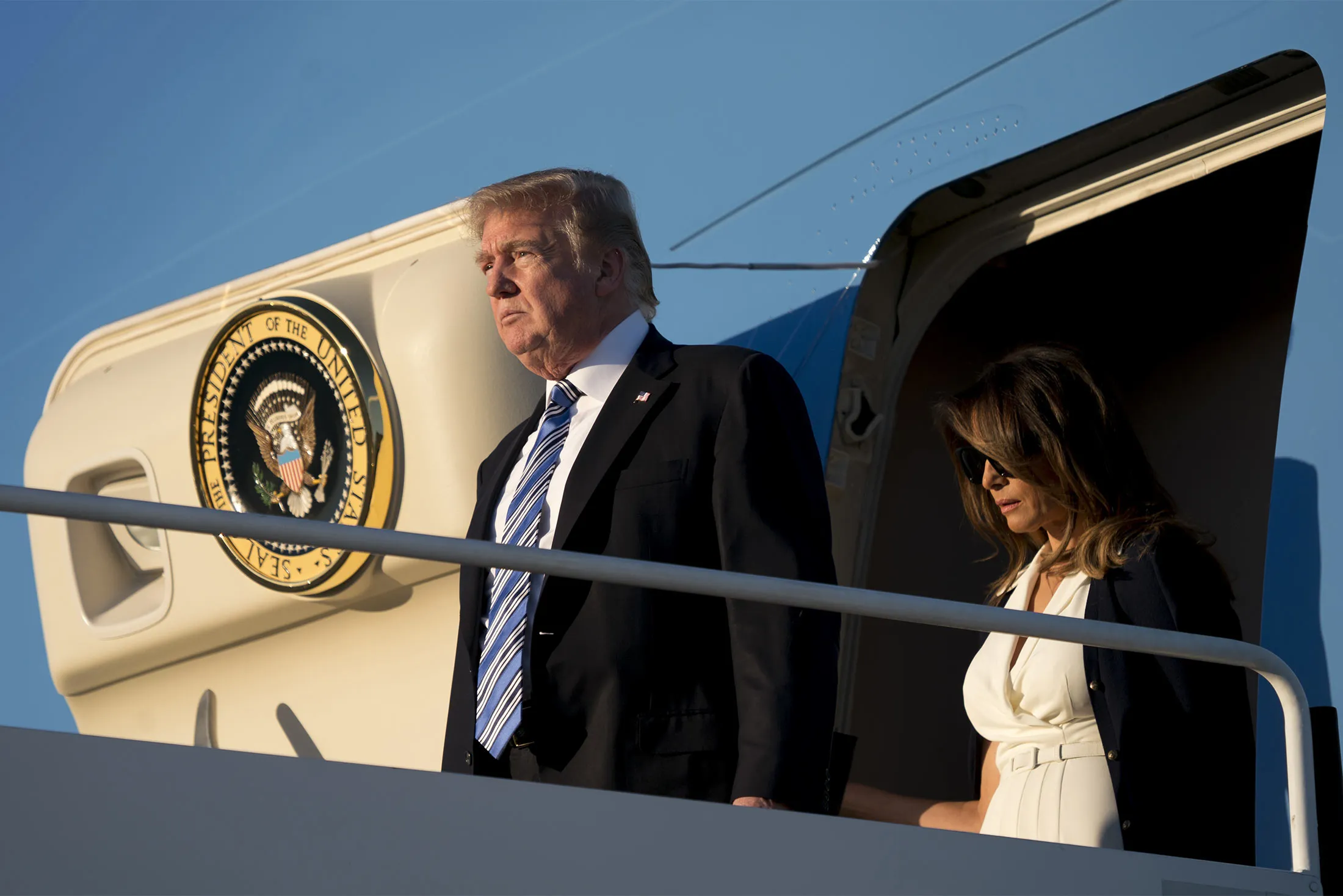 President Donald Trump accompanied by first lady Melania Trump, right, arrives at Palm Beach International Airport in West Palm Beach, Fla., Friday, Feb. 16.&nbsp;