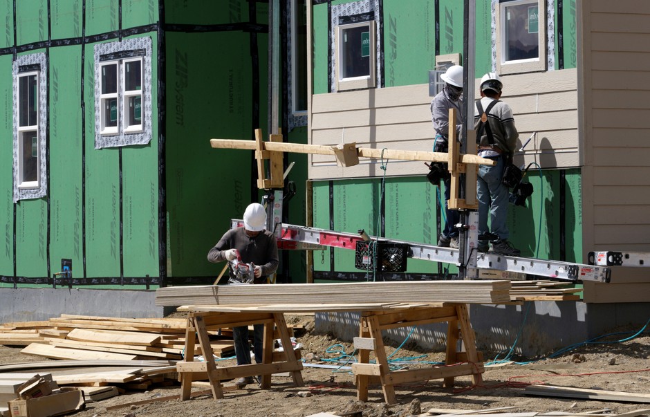 Workers building a new house in Arvada, Colorado.
