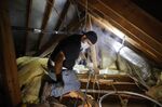 A plumber repairs a burst pipe in a home in Houston on Feb. 21.