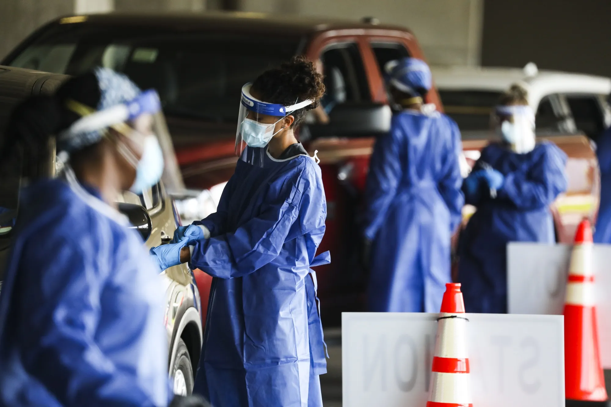 Healthcare workers test people at a Covid-19 testing site in the parking garage for the Mahaffey Theater in St. Petersburg, Florida, on July 14.&nbsp;