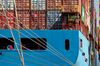 Containers are stacked on a ship berthed at Asciano Group's Patrick operations at Port Botany in Sydney, Australia, on Tuesday, Aug. 31, 2010. Australia's economic growth probably accelerated in the second quarter, helped by government spending on infrastructure and higher exports of iron ore to China even as recoveries in Japan and the U.S. showed signs of faltering.