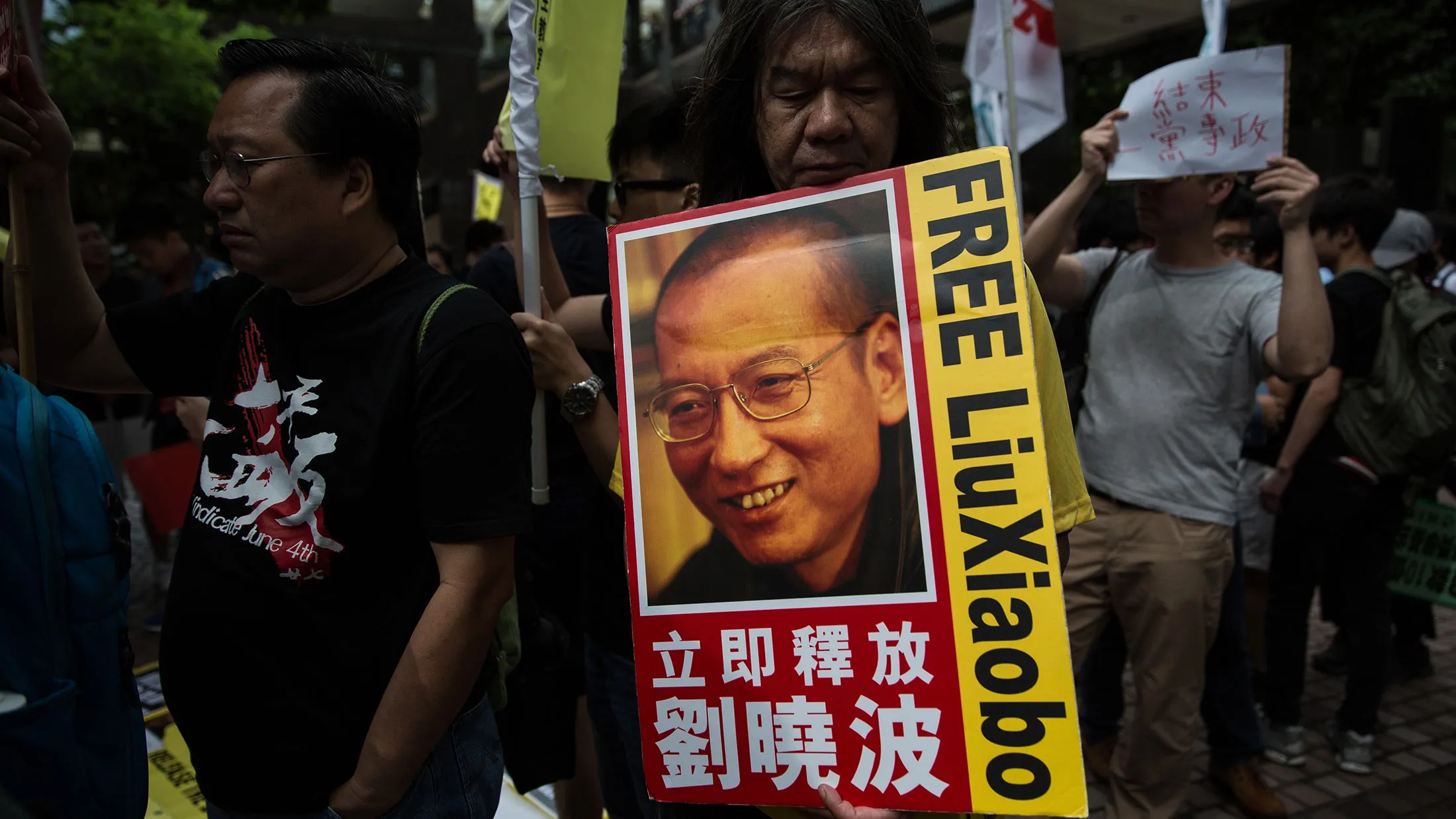 A demonstrator holds a banner of Chinese dissident Liu Xiaobo during a pro-democracy protest in Hong Kong on May 18, 2016.
