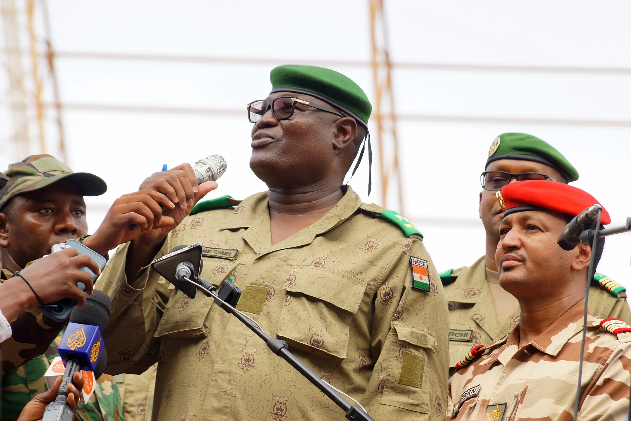Junta leader General Abdourahmane Tchiani&nbsp; speaks at the demonstration of coup supporters&nbsp;in Niamey on Aug. 6.