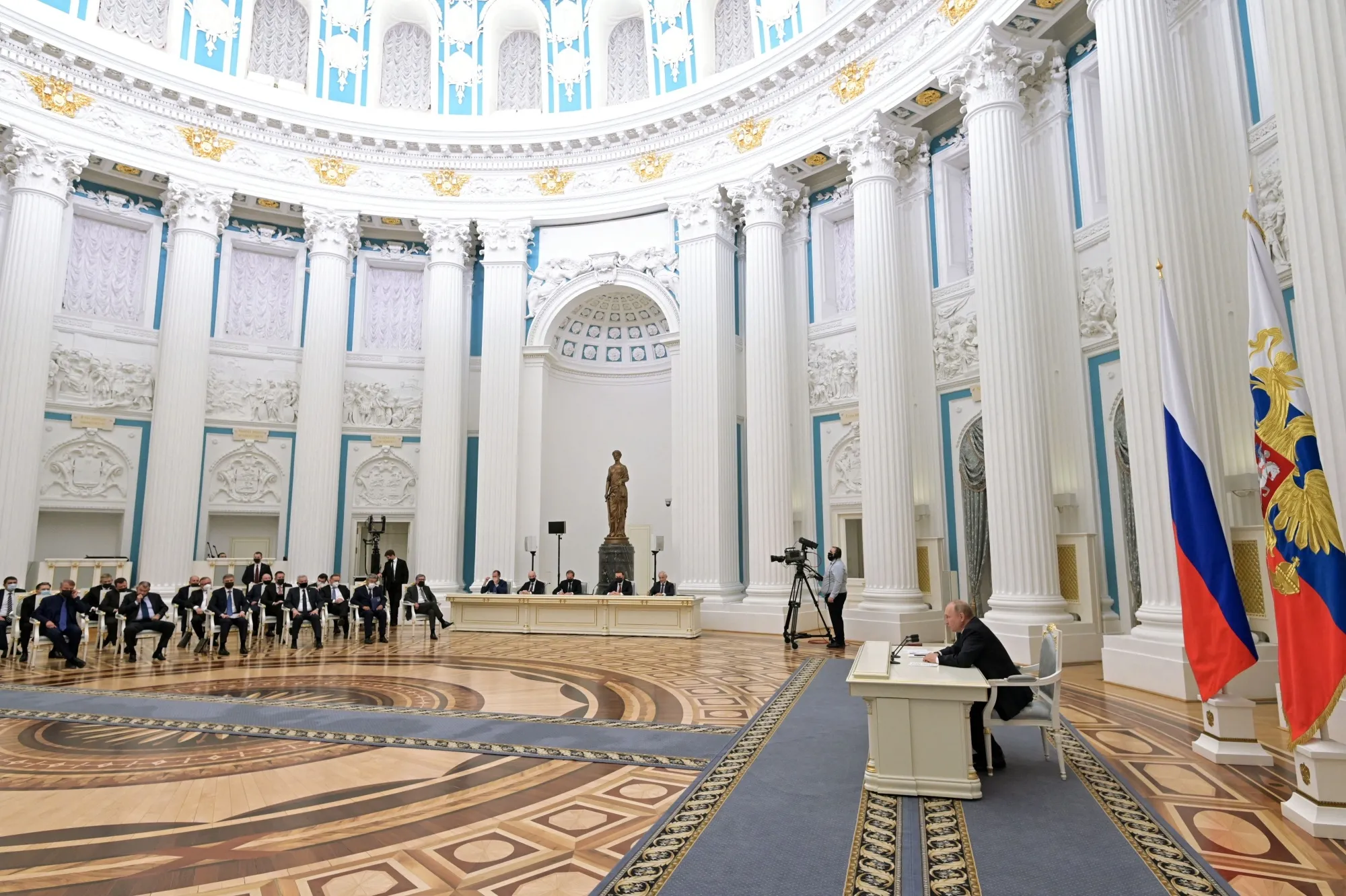 Vladimir Putin chairs a meeting with Russian business leaders in Moscow, on Feb. 24, 2022.