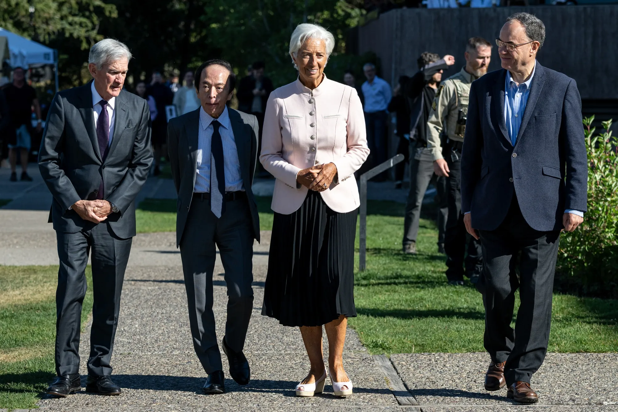 ECB President Christine Lagarde, center, walks with Fed Chair Jerome Powell, BOJ Governor Kazuo Ueda, and BOE Governor Andrew Bailey during the Federal Reserve’s Jackson Hole Economic Policy Symposium in Moran, Wyoming, on Aug. 22.