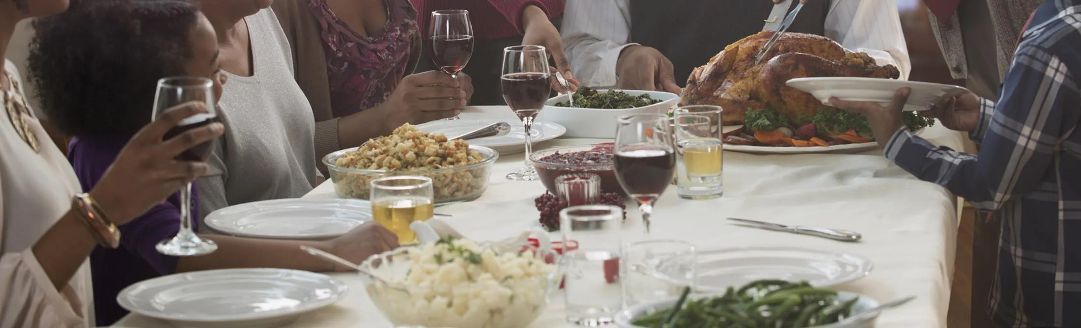 Family serving each other at holiday table