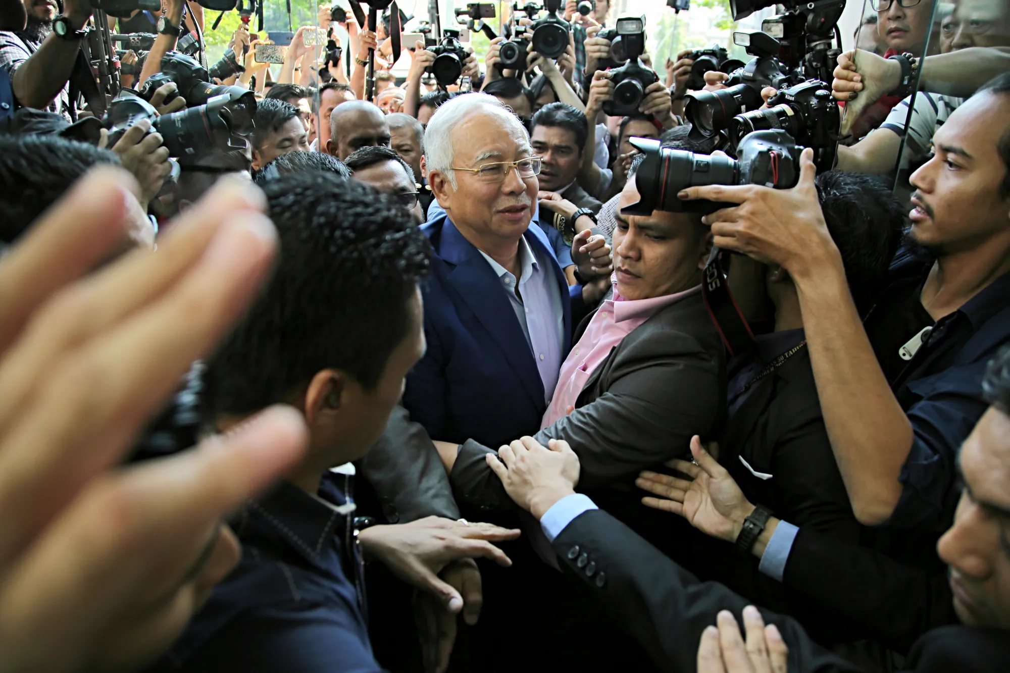 Najib, center, arriving at the Malaysian Anti-Corruption Commission's headquarters in Putrajaya, Malaysia, on May 22, 2018.