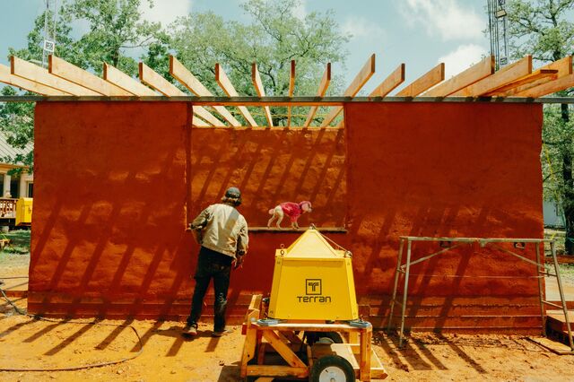 An adobe house being built with a robotic hammer developed by Danny Weddle of Terran Robotics.