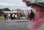People gather at a memorial for the shooting victims outside of Tops grocery store&nbsp;in Buffalo, New York.