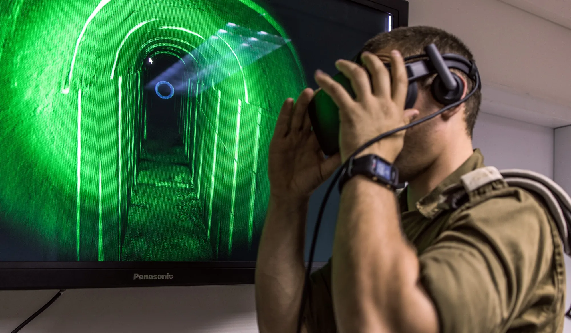 An Israeli special combat soldier adjusts a VR headset during a training exercise using virtual reality (VR) battlefield technology to simulate Hamas tunnels leading from Gaza to Israel at an Israeli Army base in Petach Tikva, Israel, on Wednesday, April 26, 2017. In a refurbished building on a military base in central Israel, soldiers are training in underground combat using headsets made by Oculus, the virtual reality headset maker owned by Facebook Inc., and Vive, owned byHTC Corp.
